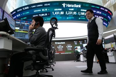 Asian shares are mostly lower after a wild day on Wall St ends with modest moves