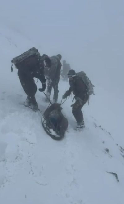 Marines save life of climber with 'ice blocks' on face trapped on Ben Nevis in -20C blizzard