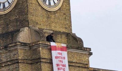 Protester who scaled 120ft London King’s Cross tower arrested by police