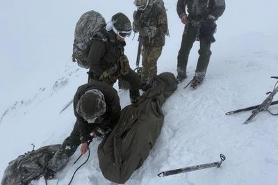 Climber found curled up on Ben Nevis in -20C blizzard rescued by Royal Marines during training exercise