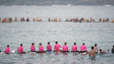 'Loved life': mass paddle-out for young shark victim