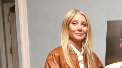 Gwyneth Paltrow embraces the viral bomber jacket trend with a cinnamon leather style paired with dark-wash jeans
