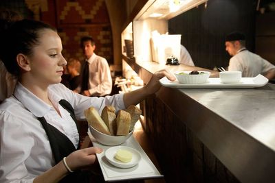 Younger and lower-paid workers hit hardest by rising labour costs, figures show