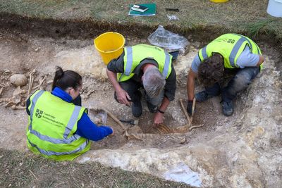 Students unearth ancient burial pit with decapitated remains