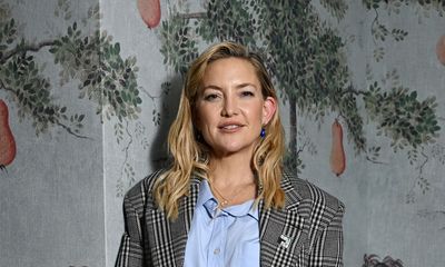 Kate Hudson embraces plaid tailoring in elegant trouser suit, sky blue shirt, and patent black slingbacks