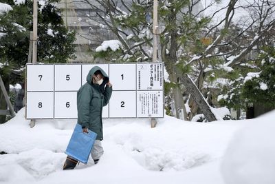 Heavy snowfall claims 30 lives in Japan and threatens to disrupt impending election