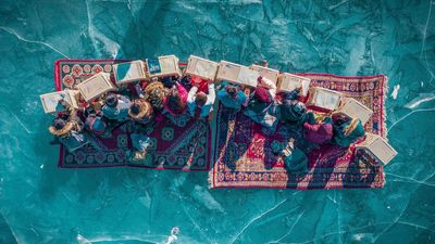 'Incredible' photo of children studying on a frozen lake is an early front-runner for DJI and SkyPixel's $200,000 drone contest