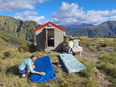 ‘Leave things better than you find them’: the volunteer army cleaning New Zealand’s remote hiking huts