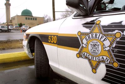 Some Detroit-area cops earned less than minimum wage due to Oracle software glitch, lawsuit says