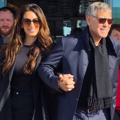 Amal Clooney Lands in Milan for the Olympics (and Endorses the Leopard-Print Trend) in Versace