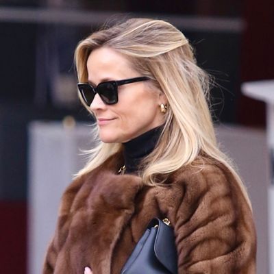 Reese Witherspoon Braves the Snow in a Luxe Fur Coat, Chunky Black Boots, and Bootcut Pants