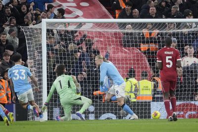 Late Erling Haaland penalty keeps Man City in title race as they beat Liverpool