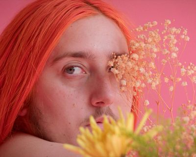Larry (They/Them) review – trans photographer’s colourful creative journey into everyday life