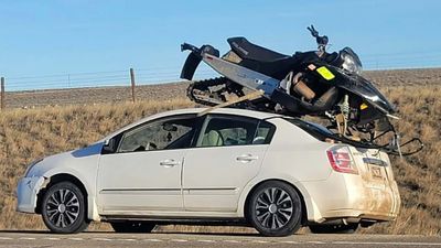 Some Hero Strapped a Snowmobile to the Top of a Nissan Altima, It Didn’t Go To Plan