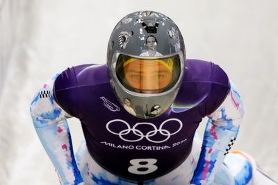 IOC urges Ukrainian racer to compete amid row over banned war victim helmet