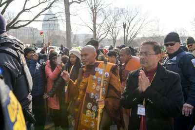 Buddhist monks walk to the US Capitol on the final day of their 15-week journey from Texas