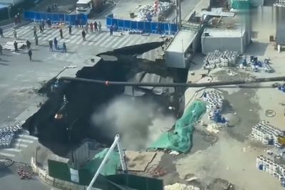 Watch: Entire street swallowed up by gigantic sinkhole in China