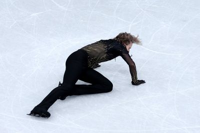 ‘Quad God’ falls to earth as Mikhail Shaidorov wins gold in figure skating drama