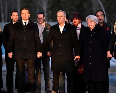 Mark Carney joins hands with Canada opposition leader as he pays tribute to school shooting victims