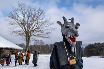 Photos show masked revelers celebrating Shrovetide in Lithuania