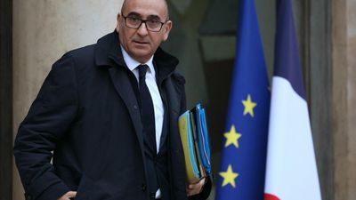 French minister in Algeria to ease relations, while journalist remains jailed