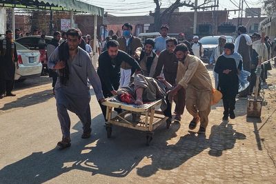Motorcycle bomb at police station kills at least 2 and wounds several in northwestern Pakistan