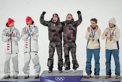 Austria wins gold in 1st Olympic men's super team ski jump as event is shortened due to weather
