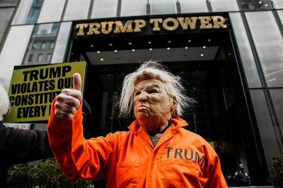 Flashmob protesters block New York’s 5th Avenue in front of Trump Tower on Presidents Day