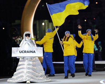 Russian woman carried Ukraine team placard at Winter Olympics opening ceremony