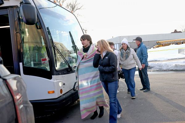 Police credit a good Samaritan for ending a deadly shooting at a Rhode Island ice rink