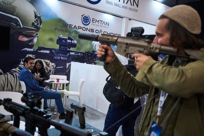 Photos of rifles, drones and missile footage at the Defense Tech Expo Israel 2026