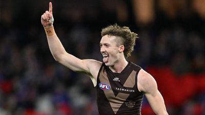 Arch-rivals' bid fails as AFL young gun re-signs