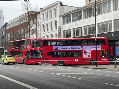 Six people in hospital after double-decker crashes into London theatre in two bus collision