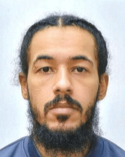 Police offer £10,000 reward as they name suspect in murder manhunt