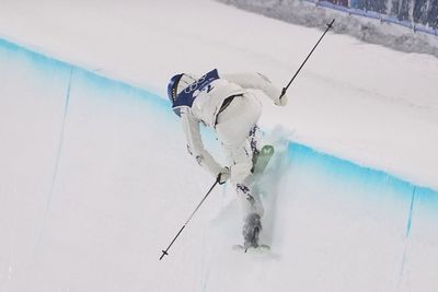 Olympics star Eileen Gu falls as she defends freeski halfpipe crown