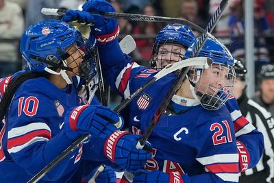 Photos show United States triumph to win third Olympic gold in women's hockey