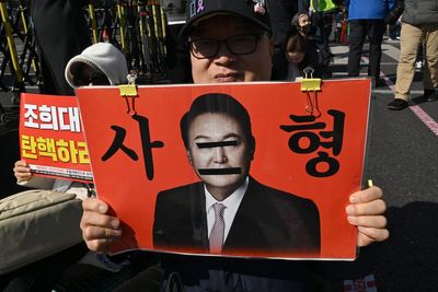 South Korea’s Yoon apologises after receiving life sentence over martial law decree