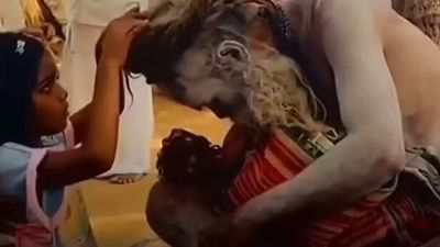 Crowd Left Speechless as Aghori Bows Before Innocent Child; Internet Calls It ‘True Spirituality’