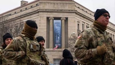 ‘Full blown North Korea vibes’: Huge banner with Trump’s face displayed at Justice Department HQ sparks backlash