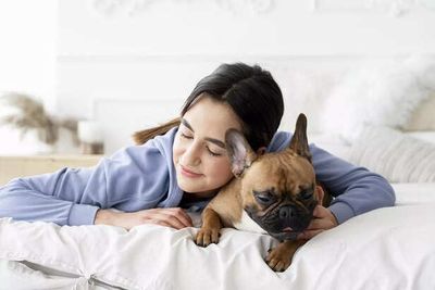 Sleeping With Your Pet: Comfort, Connection Or A Hidden Health Risk?