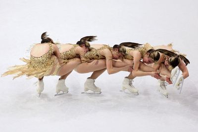 Olympic photographers are using a 160-year-old technique to create art on ice, freezing ice skaters in ethereal photographs