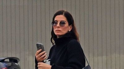 Sandra Bullock's turn-up jeans and chunky black boots are the chic uniform that will see you through the cold snap