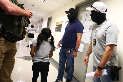 Scammers created fake courtroom and law firm to prey on immigrants, DOJ says