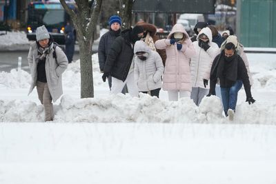 Blizzard warnings send East Coast scrambling to prepare for heavy snow and strong winds