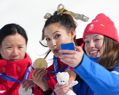 China’s Eileen Gu soars to ski halfpipe gold but controversy surrounds Zoe Atkin’s bronze