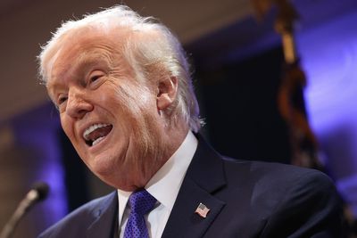 Trump shares right-wing conspiracy theorist’s post that calls Michelle Obama ‘anti-white racist’ after he posted racist ape video