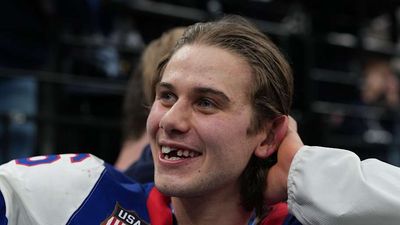 USA Men's Hockey Team Carries Jack Hughes Through Olympic Village After Golden Goal