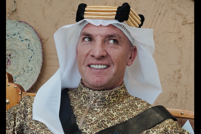 Ex-Liverpool manager Brendan Rodgers poses with gun wearing traditional Saudi dress in promotional video