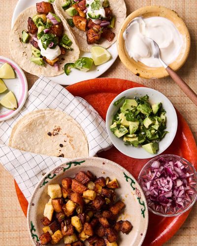 Georgina Hayden’s quick and easy recipe for roast butternut squash, halloumi and avocado tacos