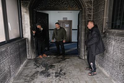 Israeli settlers torch and deface a West Bank mosque as Ramadan begins